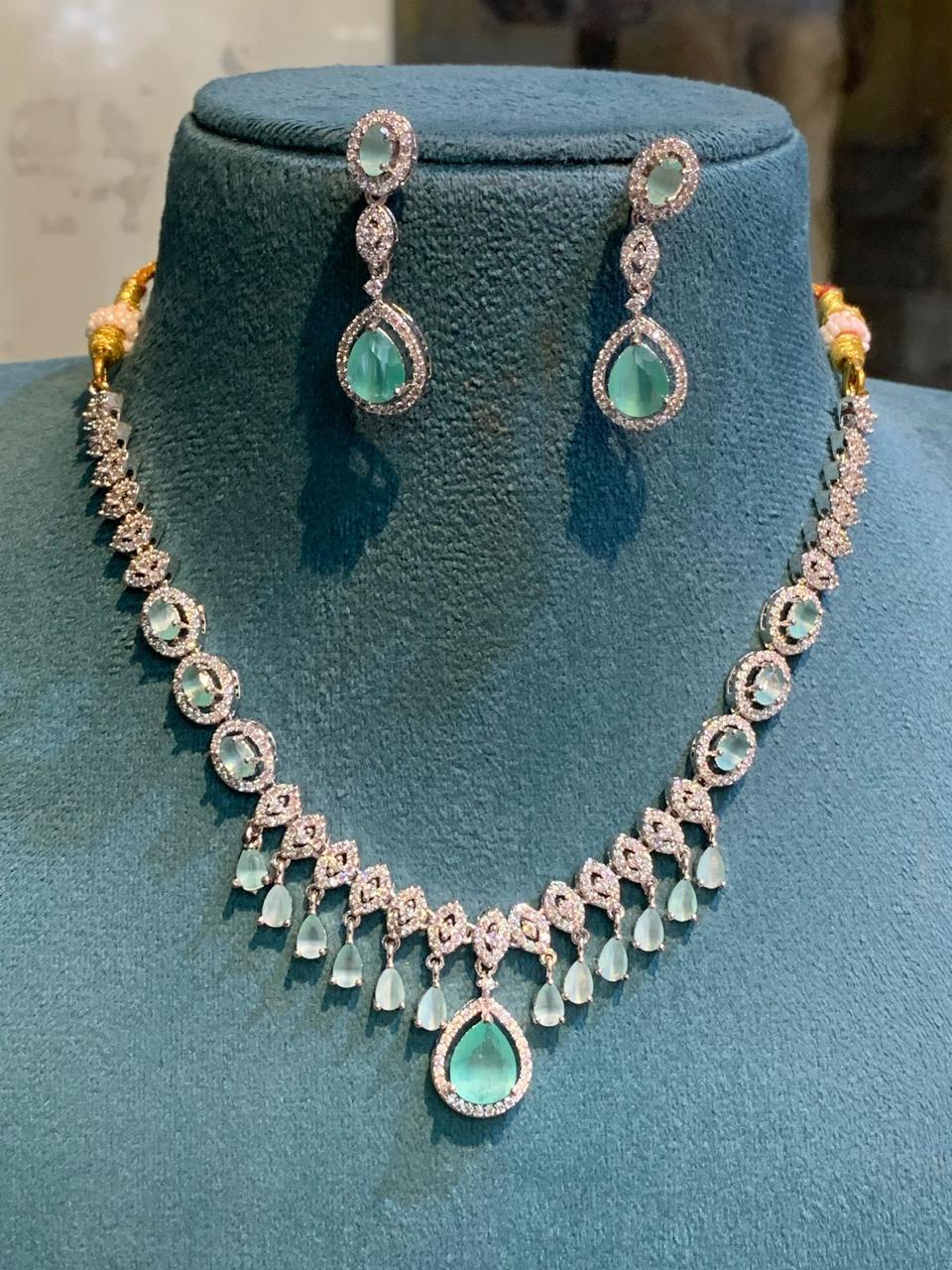 Exquisitely Designed American Diamond Stone Necklace Set With Earrings