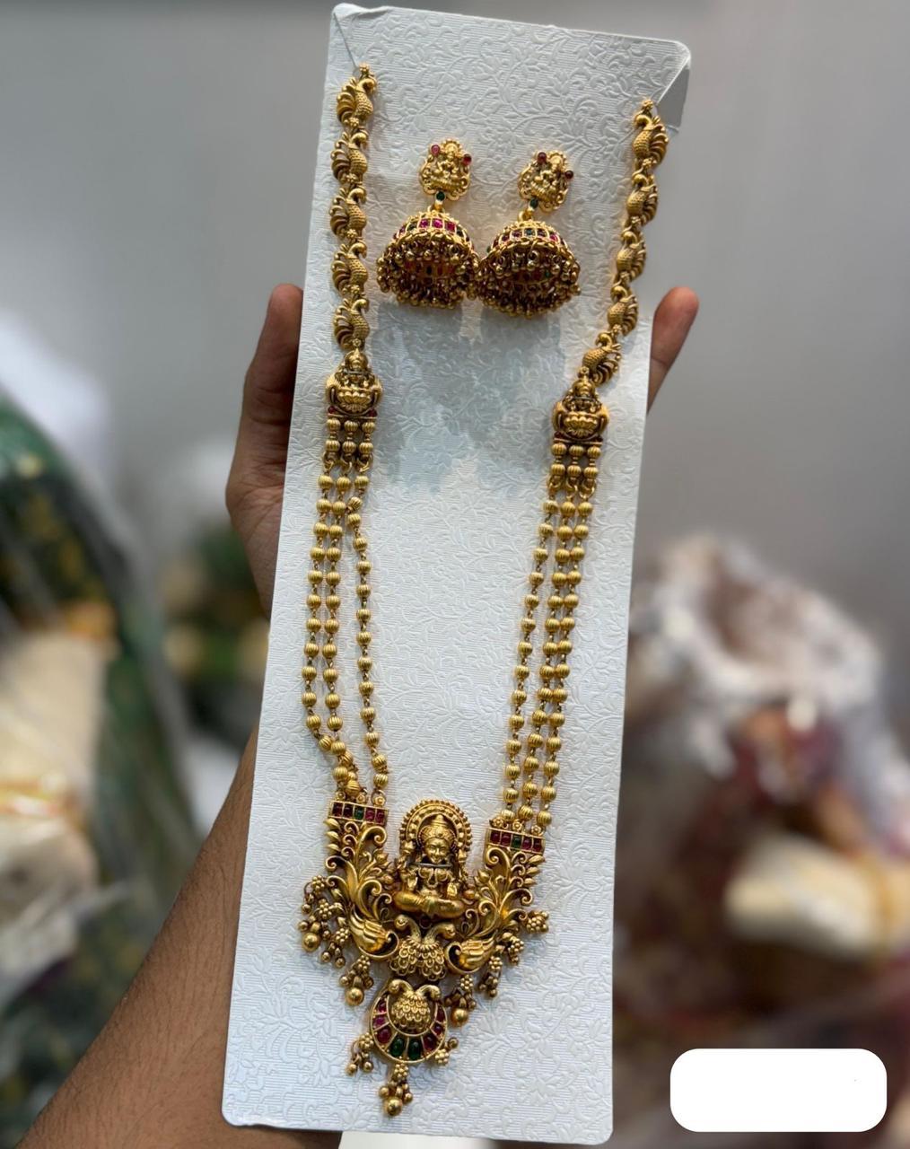 Temple Jewelry Matte Finish Lakshmi Motif Chain Necklace Set With Earrings - Multicolor